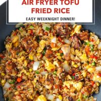 Tofu fried rice with vegetables and scrambled eggs in a wok. Text overlay "Air Fryer Tofu Fried Rice" and "Easy Weeknight Dinner!".