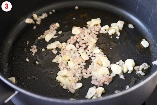 Sautéed garlic and shallots in a pan with extra virgin olive oil.