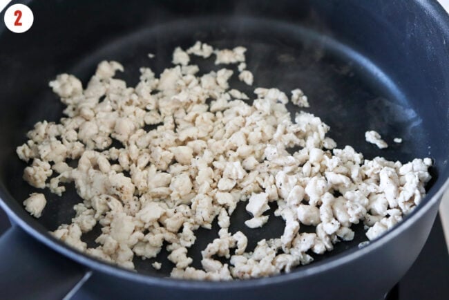 Cooked ground chicken in a pan.