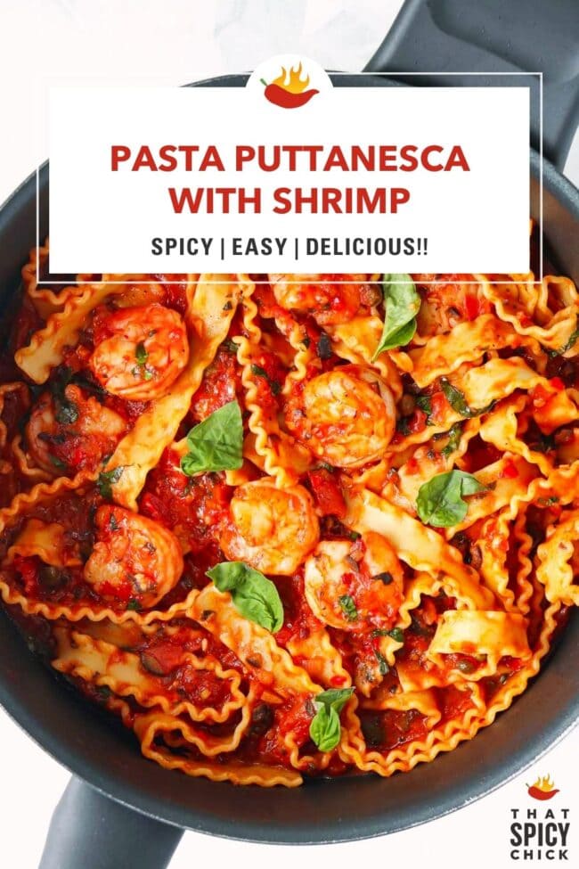 Pan with spicy tomato sauce pasta with shrimp topped with basil leaves. Text overlay "Pasta Puttanesca with Shrimp", "Spicy | Easy | Delicious!!" and "That Spicy Chick".